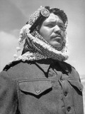A Soldier from the Arab Legion Squinting His Eyes to Keep Out the Sun