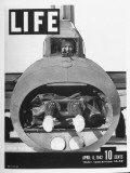 Cover of Life Magazine of Crewman Manning Machine Gun in Tail of B-17E Flying Fortress