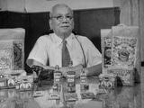 Tiger Balm King Aw Boon Haw, Sitting with His Patent Medicines