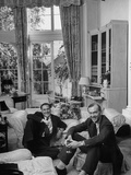 Film Director Carol Reed and Author Graham Greene Sitting on the Floor with Wine Glasses