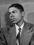 A Young Man Posing for His Portrait for Winning the Dunbar H.S. Scholarship Winners