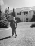 San Angelo Bigshot Ray Willoughby Posing in Front of His House