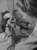 Buy Artist at Madame Tussaud's Waxworks Inserting Hair in Sculpture of Gen Douglas A. Macarthur at AllPosters.com