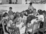 The Nursery School Teacher Reading a Story on Saturday Afternoon