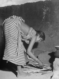Young Woman of Untouchables Caste, Preparing Wood to Light Fire for Cooking