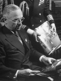 Buy US President Harry S. Truman Reviewing Photographs with Naval Aide at AllPosters.com