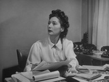 Russian-Born Dress Designer Valentina Working at Desk in Her Office