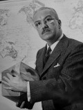 American Engineer and Architect Buckminster Fuller Holding a Globe