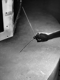 Chain of Nails Being Held Together by Powerful Field of New Cyclotron's Magnet at Columbia Univ