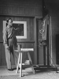 Painter Millard Sheets Looking over One of His Canvases