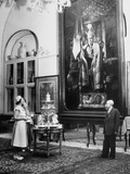 Mrs. with Averell Harriman and Mrs. Henry Grady Looking at a Full Length Portrait of Reza Shah