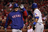 Texas Rangers v St Louis Cardinals, St Louis, MO - Oct. 27: Derek Holland and Elvis Andrus