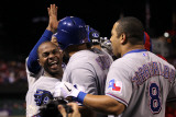 Rangers v Cardinals, St Louis, MO - Oct. 27: Nelson Cruz, Esteban German and Yorvit Torrealba
