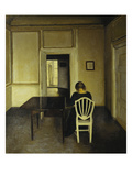 Interior with a Woman Seated on a White Chair