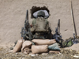 Buy A U.S. Marine Sniper Observes His Sector at a Patrol Base Near Sangin, Afghanistan at AllPosters.com