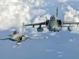 A Dassault Rafale of the French Air Force Flys Alongside an Embraer A-1B of the Brazilian Air Force