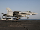 A US Navy F/A-18C Hornet Prepares to Land Aboard USS Eisenhower