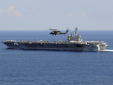 Buy An MH-60S Seahawk Helicopter Flies over USS George H.W. Bush at AllPosters.com