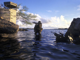 A Pair of Navy Seal Combat Swimmers Transition from Underwater to the Surface