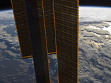 Buy Solar Panels of the International Space Station Backdropped by a Blue and White Earth at AllPosters.com