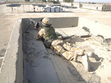 A British Soldier Provides Security from a Rooftop in Basra, Iraq