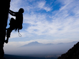 A Climber Ascends an Overhang at Dusk 500 Feet Off the Ground