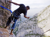A Climber Leans Out to Take a Photo from 500 Feet Up