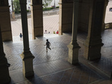 Boy Running Out of Building at the Plaza De Espana in Seville, Spain