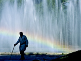A Uzbek Man Passes in Front of a Fountain in Central Tashkent