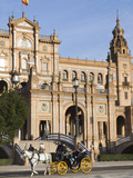 Tourists Taking a Horse-Drawn Carriage Ride at the Plaza De Espana