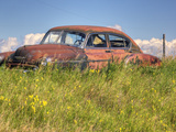 A 1950 Chevrolet Styleline Deluxe 4-Door Sedan Sits Idle in a Field