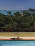 Woman Suntans Beside a Swimming Pool in the Turks and Caicos