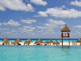 The Caribbean Sea, Tiki Huts and a Lifeguard Stand from a Resort Pool