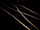 Golden Evening Sunlight Reflects Off Railroad Tracks