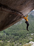 Buy A Climber Scales a Route on Seperate Reality, a Hanging Roof Crack at AllPosters.com