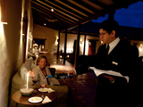 A Waiter Pours Wine at a Boutique Hotel and Winery
