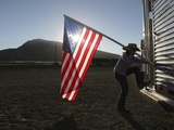 Putting Away the Flag after the Opening Ceremony at Cody Nite Rodeo