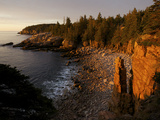 The First Rays of Sunrise on Monument Cove and its Namesake Rock Pillar