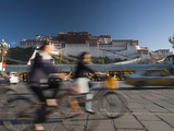 Buy Bicyclists and Traffic in Front of the Potala Palace at AllPosters.com