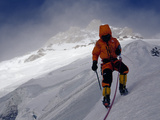 A Climber Ascends a Steep Slope of Nanga Parbat in Stormy Conditions