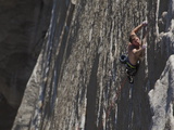 A Climber Clings with Fingertips to El Capitan