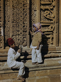 An Indian Boy Reads to a Young Girl
