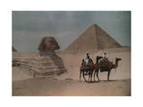 Two Men on Camelback Ride Past the Sphinx and Great Pyramid