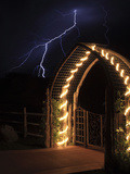 A Lightning Bolt Comes Out of Night Sky Near a Farm Gate