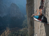 Buy A Climber Reclines on a Hanging Camp on El Capitan at AllPosters.com
