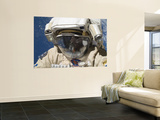 Buy A Russian Cosmonaut Wearing a Russian Orlan Spacesuit During a Spacewalk at AllPosters.com