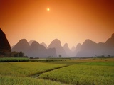 Rice fields an chalk mountains at twilight, Yangshou, Guangxi Province, China