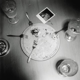 Plate with forks and glasses on a table