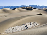 Cracked Rock Formation Amongst Sand Dunes