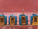 Wooden Bird Cages Against Ancient City Wall